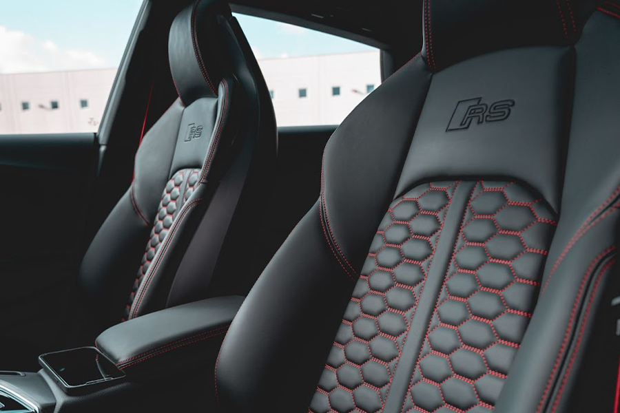 Interior shot of black with red trim leather car seat covers