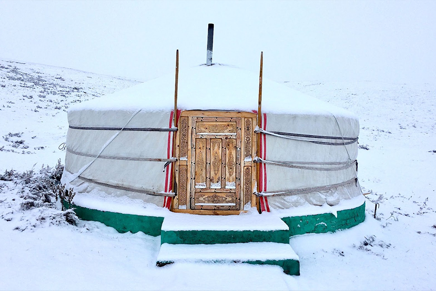Mongolian-style yurt in snowfall
