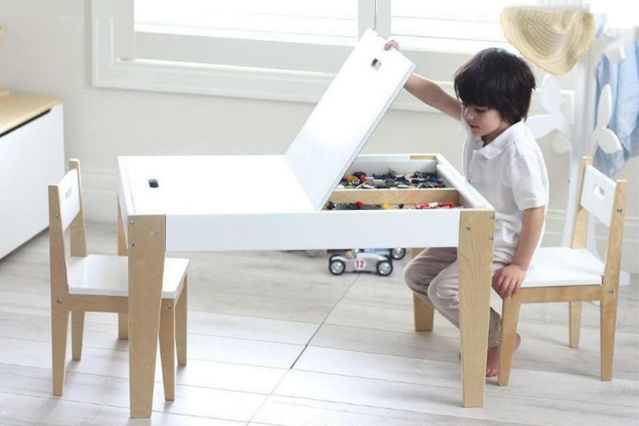 Kid using a table with in-built s