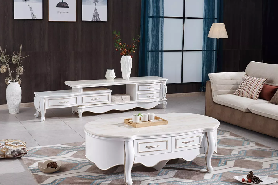 A white coffee table with cabriole legs