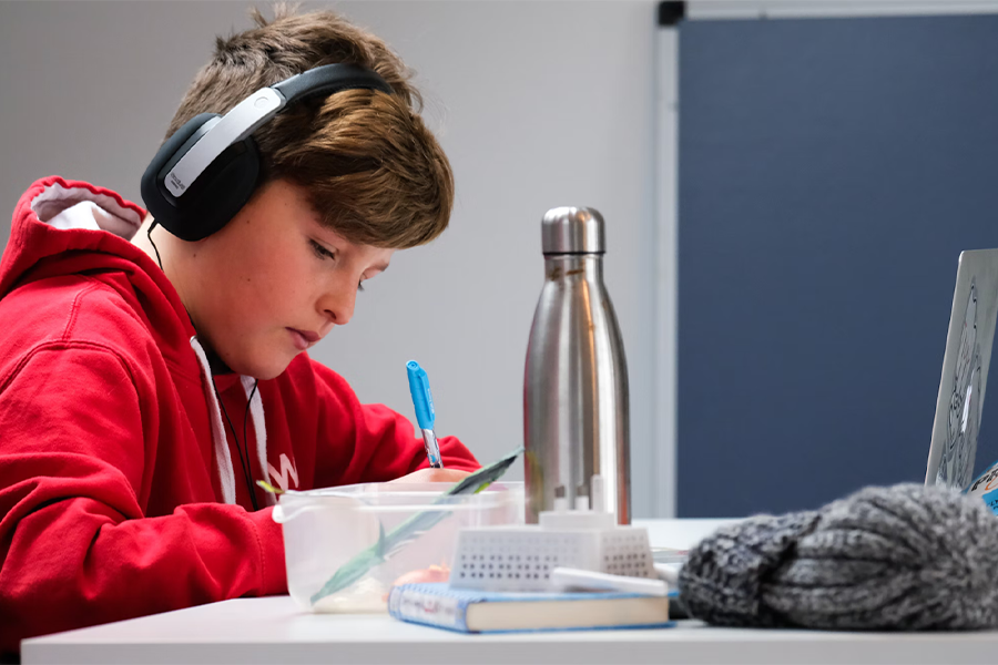 Boy doing his homework at a desk