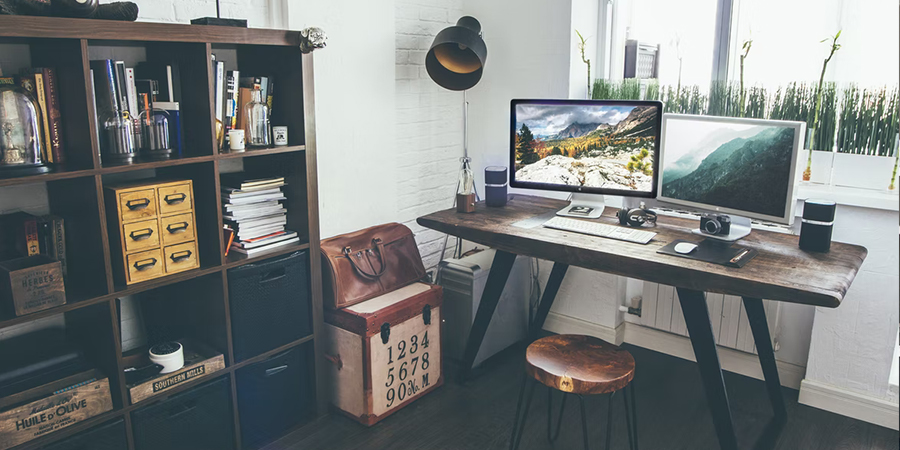 Adjustable white desk in a home office setup