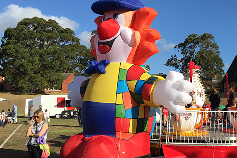 An inflatable balloon clown character at a kids’ park