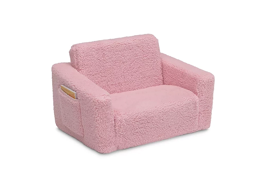 Soft pink kids’ sofa chair with side pocket