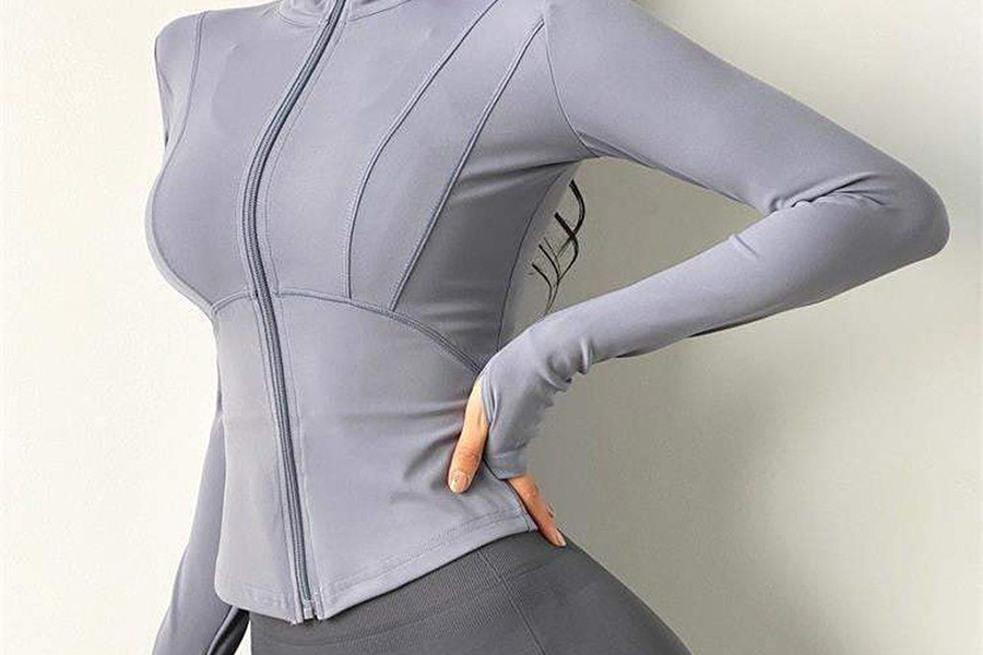 Curvy model rocking gray post-workout jacket