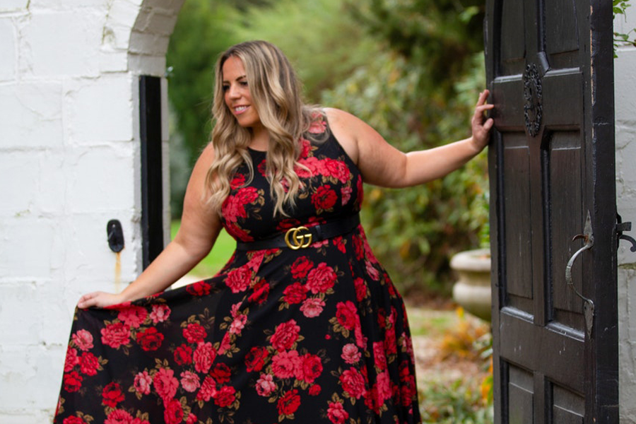 Plus-size lady in red and black garden party dress