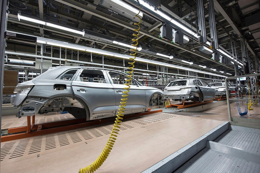 Vehicles on an assembly line at a manufacturing plant