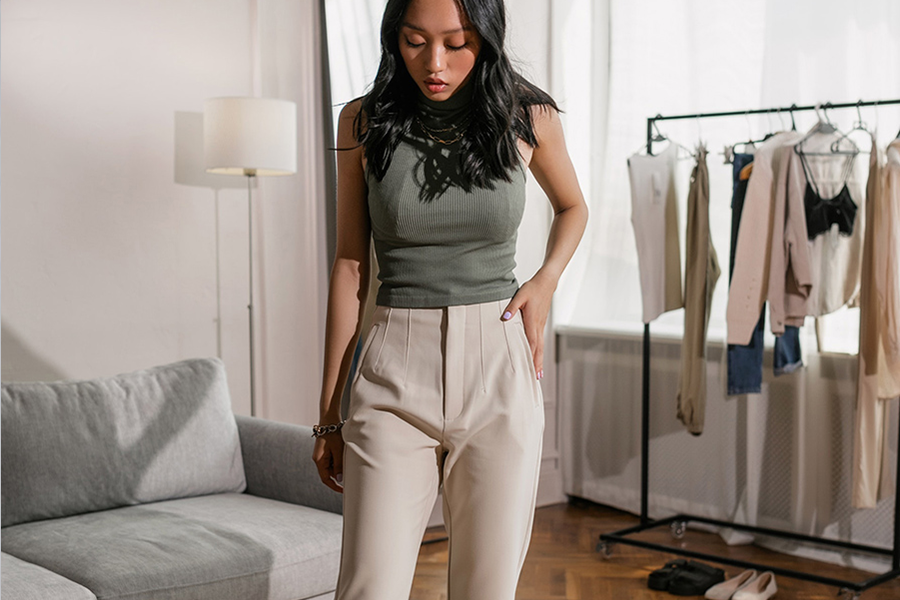 Lady in gray top and cream high-waist pants