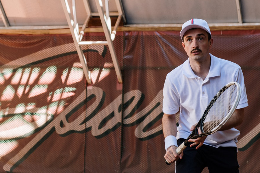 shirt holding a racket