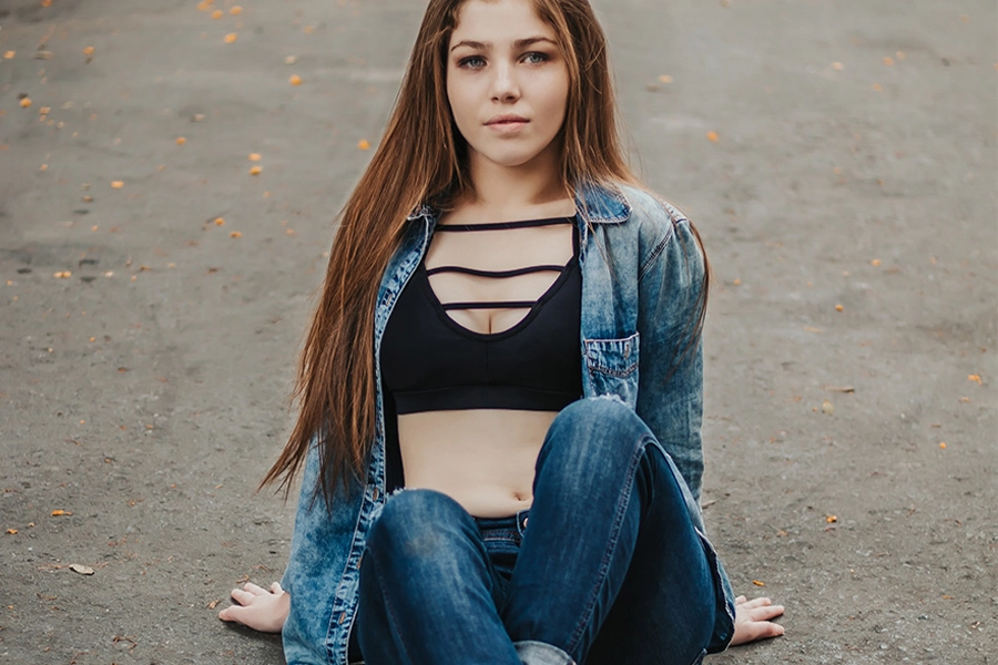 Young lady rocking push-up sports bra with denim