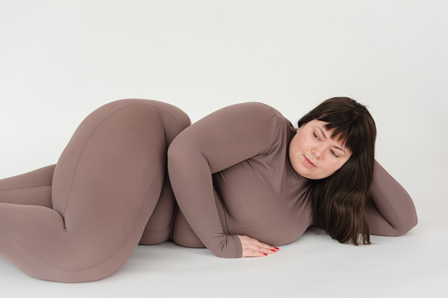 Plus-size woman in brown activewear