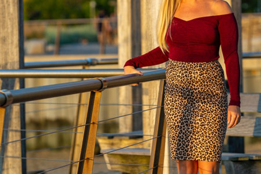 A woman wearing a leopard print pencil skirt