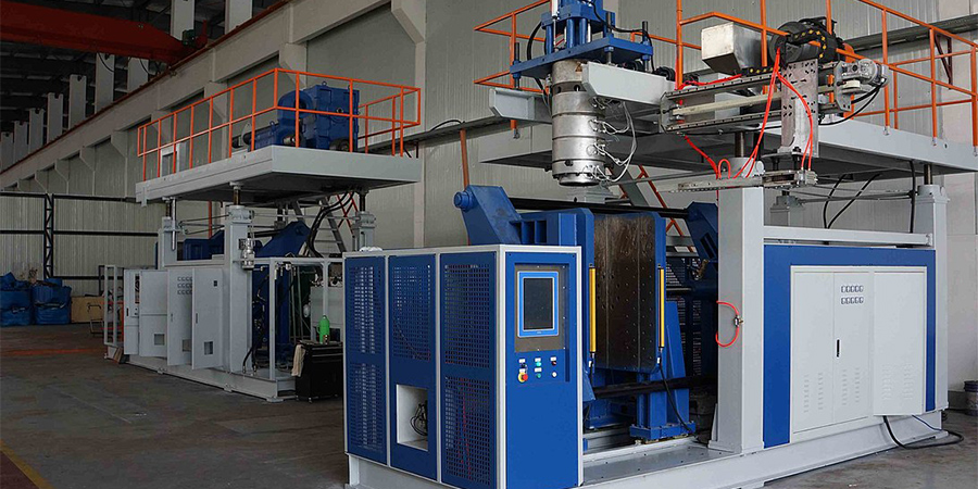 A large blue molding machine in a factory