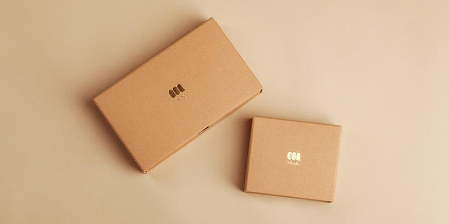 Cardboard packaging boxes with gold foil stamp logo