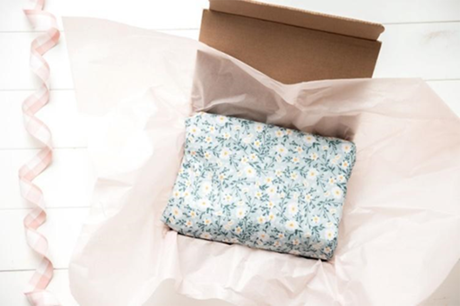 Blue and white floral tissue paper with pink packing paper