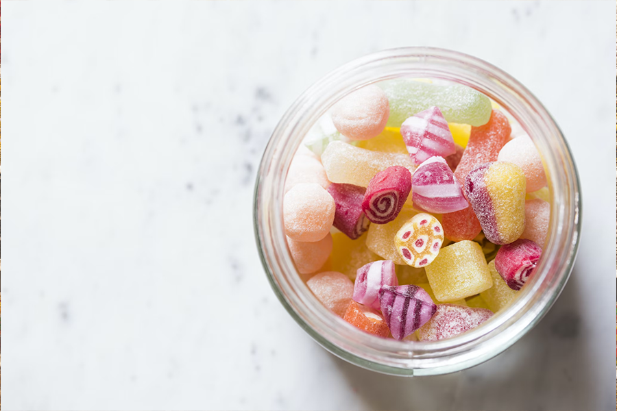 Assorted candies in a glass jar