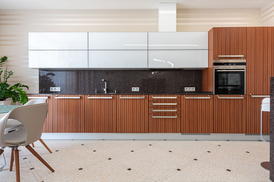 Modern kitchen space with light patterned vinyl flooring installed