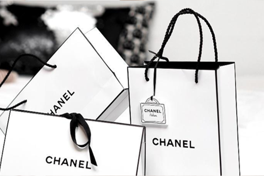 White and black Chanel shopping bags