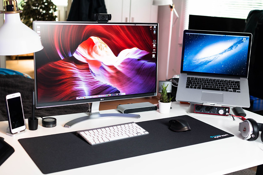Multi-screen desktop setup with LG and Apple products