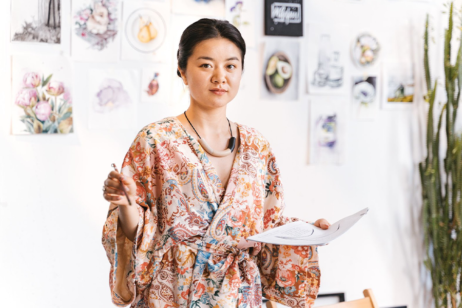 Woman wearing loose paisley-print kimono
