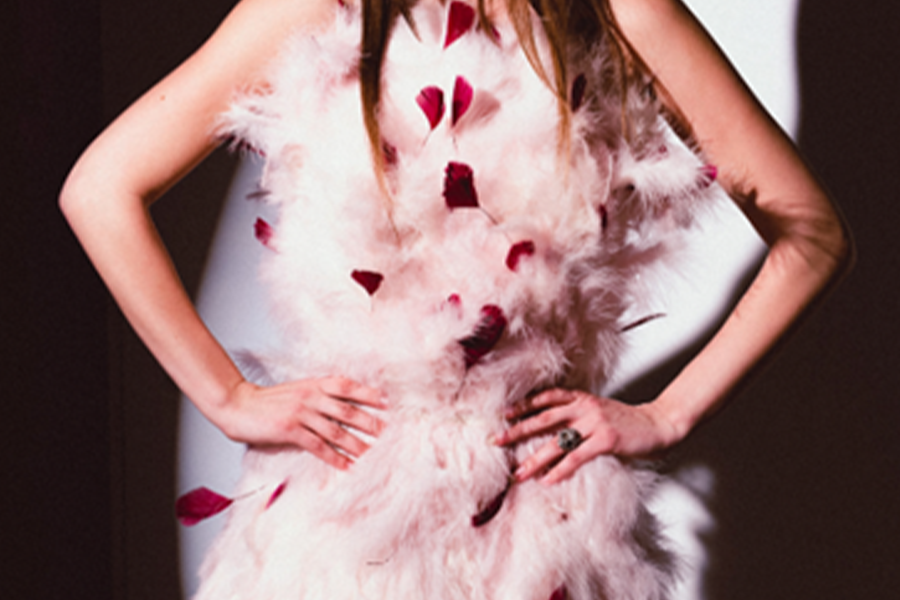 Woman wearing light pink feather dress