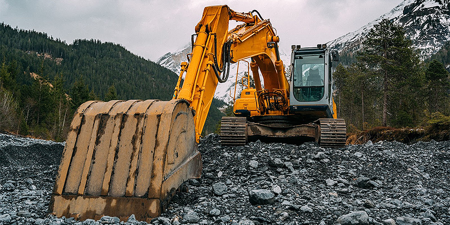 Al Excavator Lying Idle In Mountain Area Without Driver