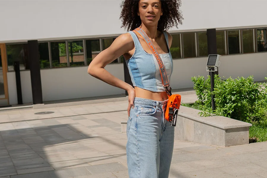 A skateboarder wearing a wide-leg jean and crop top