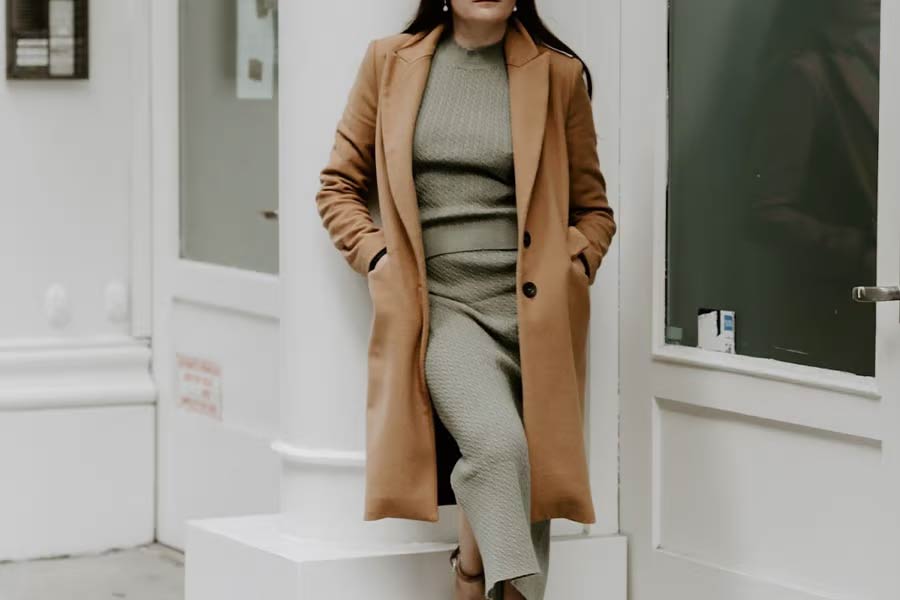 A woman wearing a suede trench coat