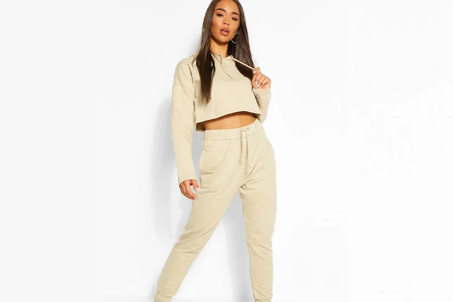 Beautiful lady in two-piece crop-top and tracksuit