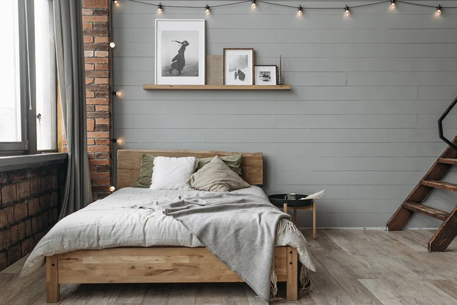 Cozy wooden bed frame next to a window