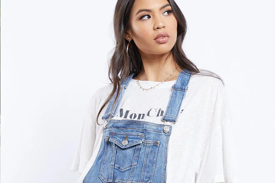 Lady in oversized white tee with dungarees