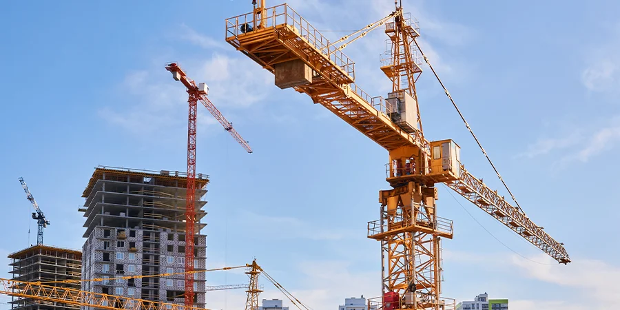 Orange crane in a construction site