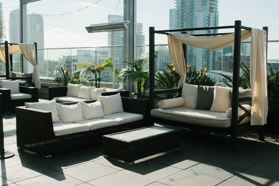 patio lounge chair with fabric canopy on a rooftop