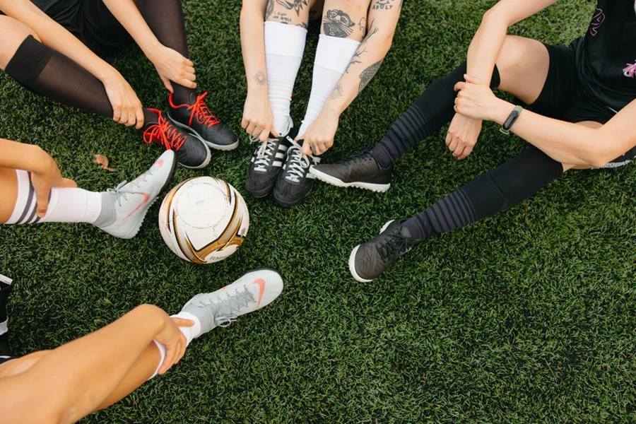 Soccer players wearing their soccer shoes on a field