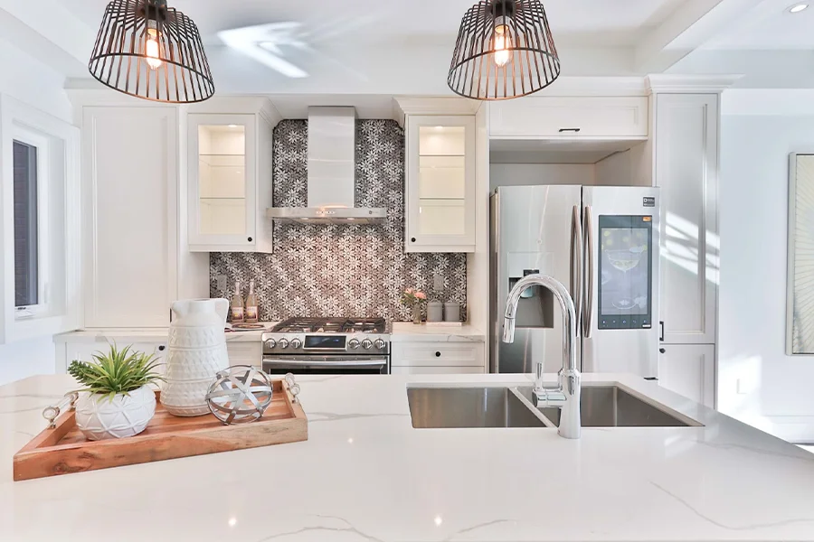 White modern kitchen with flower-patterned backsplash