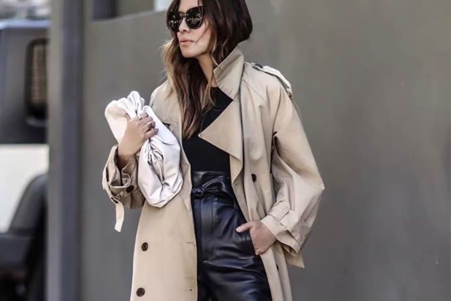Woman in beige utility wear and black leather pants