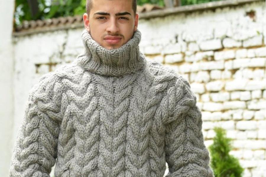 A man wearing a large roll neck sweater