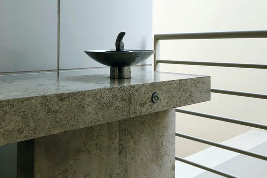 A gray color sink on a counter