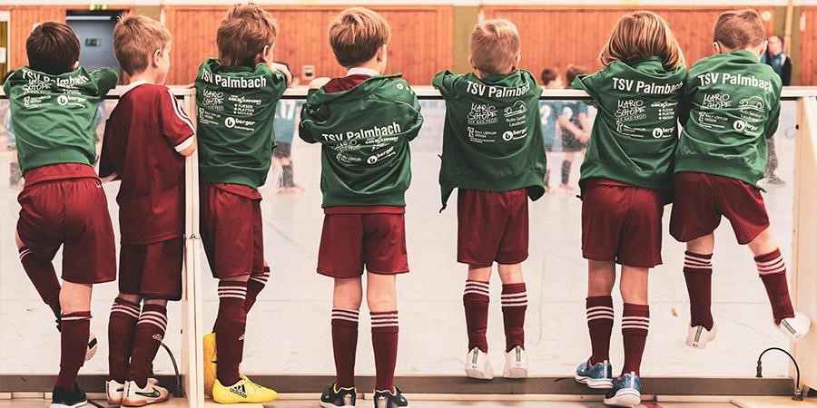 A group of children wearing sports jerseys
