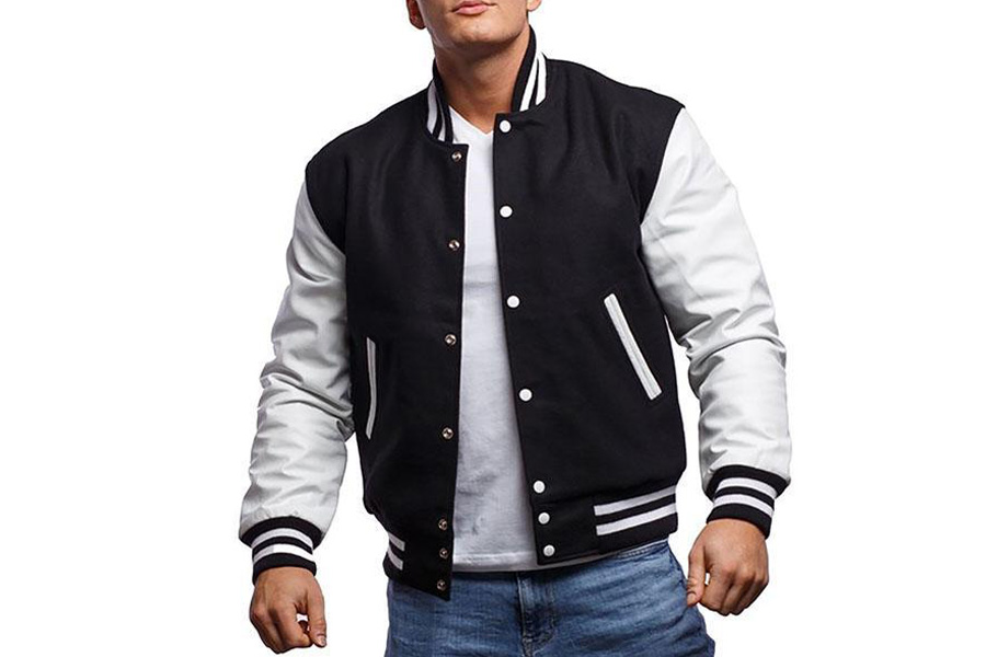 A man in a black and white letterman jacket