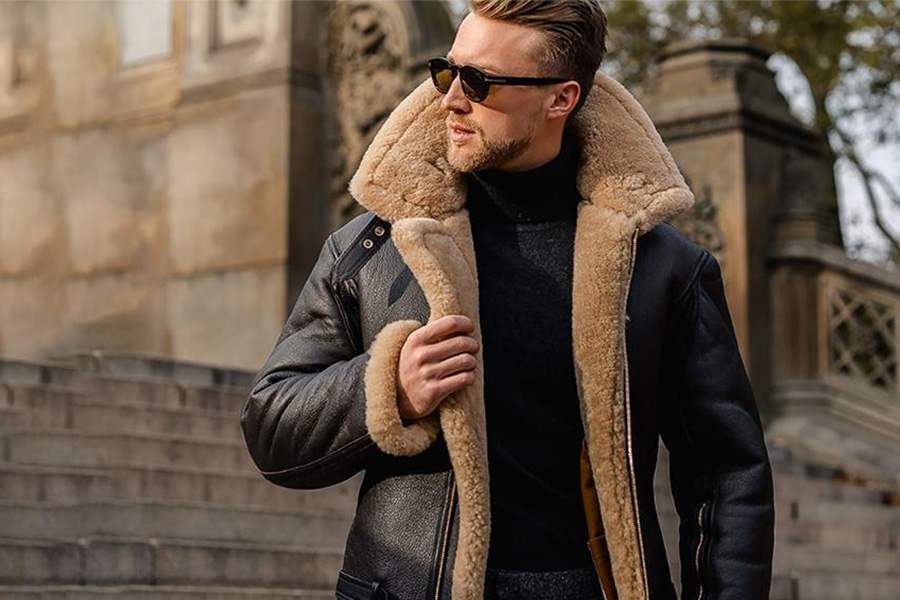 A man wearing a leather shearling coat