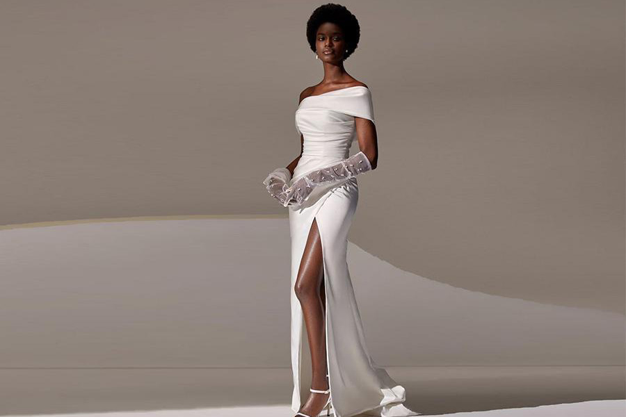 A model rocking a high slit wedding dress