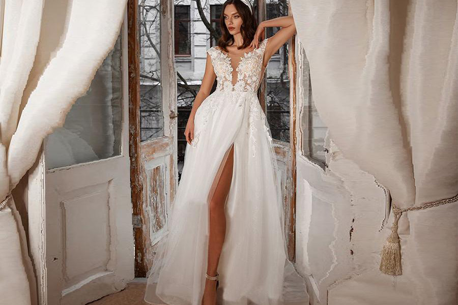 A sexy model rocking high-slit wedding gown