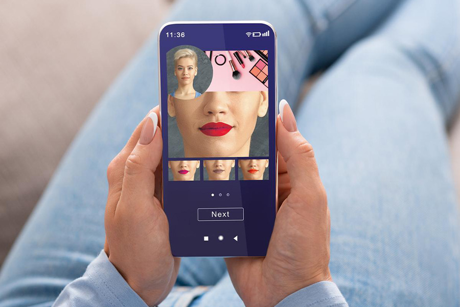 A woman trying different lipstick using an augmented beauty app