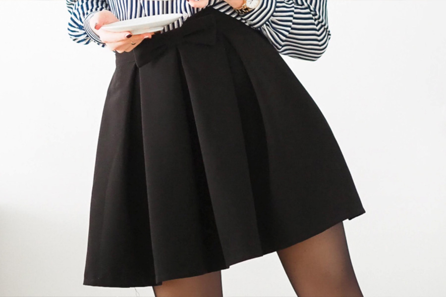 Black pleated A-line mini skirt for women