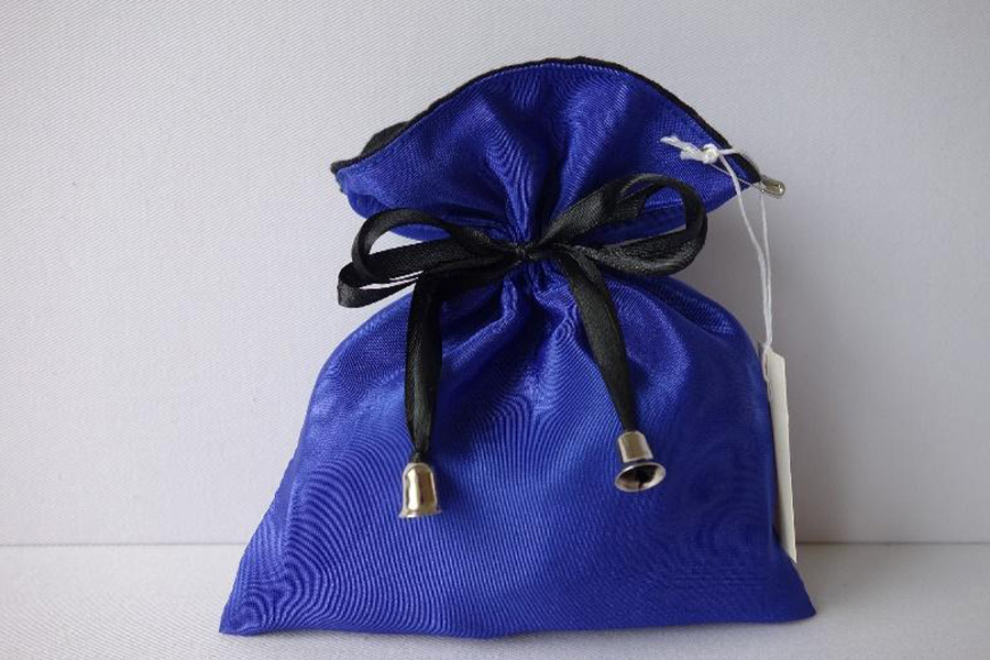 Blue satin accessory bag with black bow