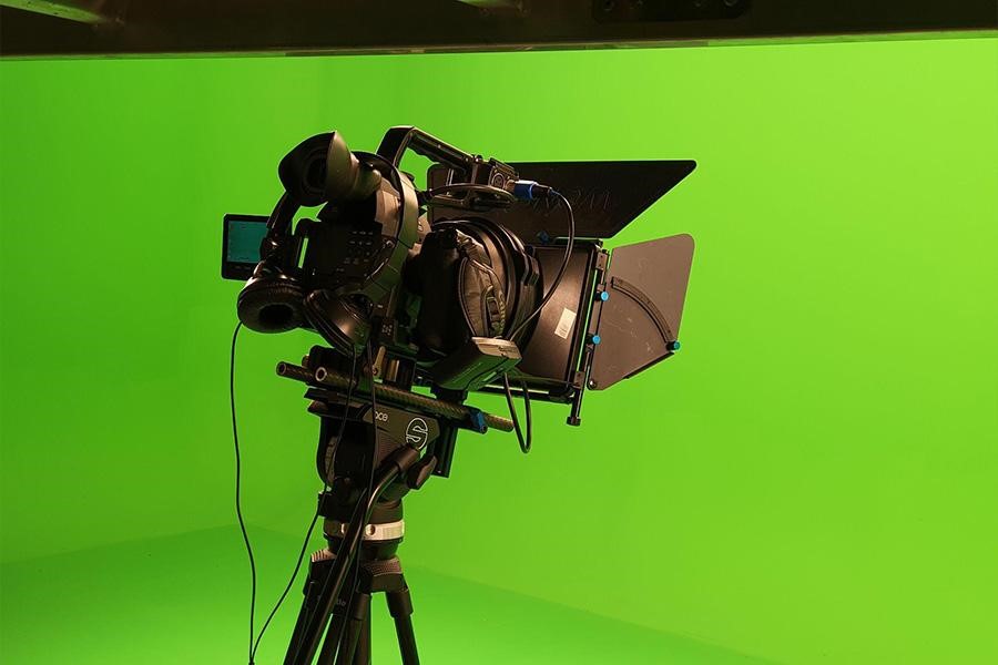 Camera in front of green-screen background