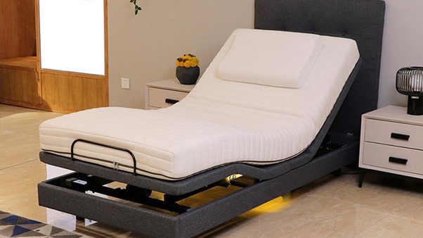 Electric Adjustable Bed With White Mattress And Black Frame