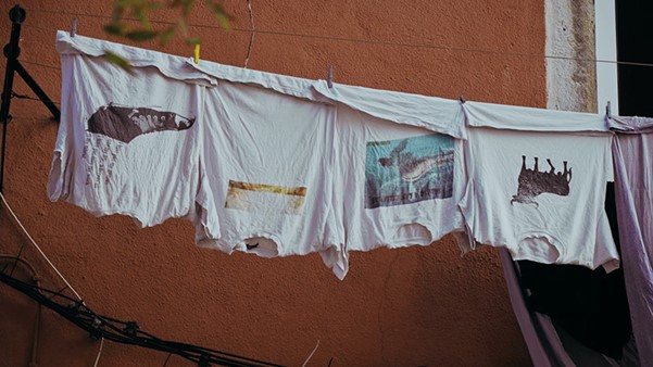 Graphic Tees Hanging On A Clothesline