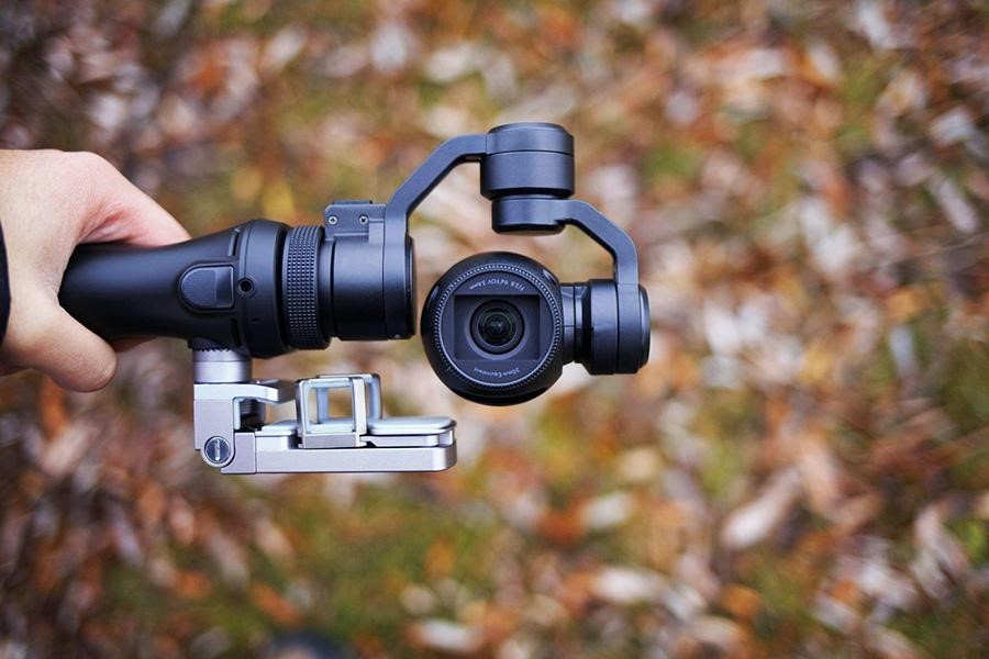 Handheld gimbal with a fixed lens